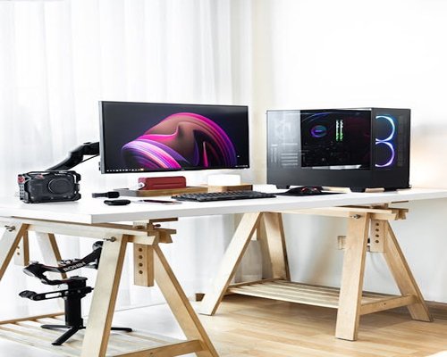 dual monitor setup on wooden desk